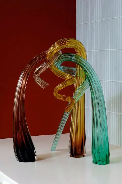 a glass sculpture on a table