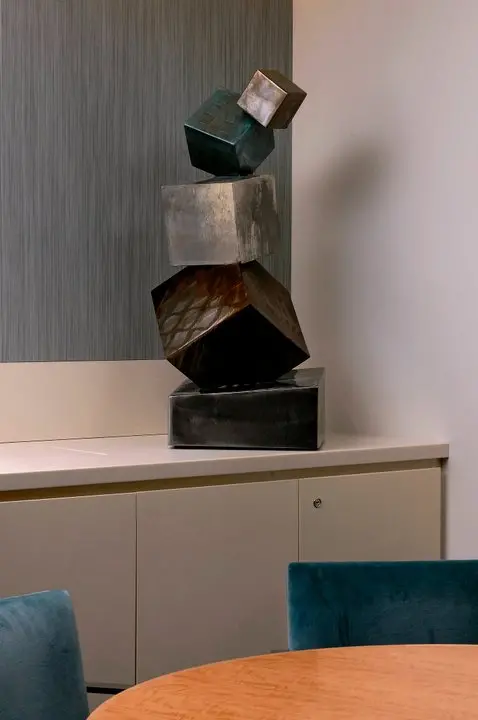 a sculpture of multiple cubes on a counter