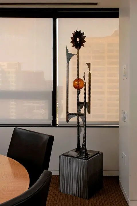 a sculpture on a pedestal in a room