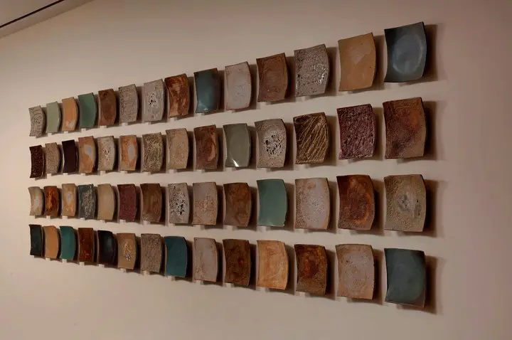 a wall with many plates