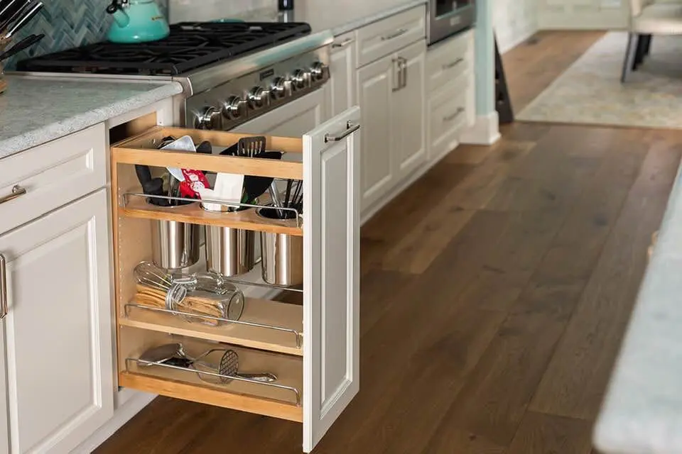 a kitchen with a cabinet door