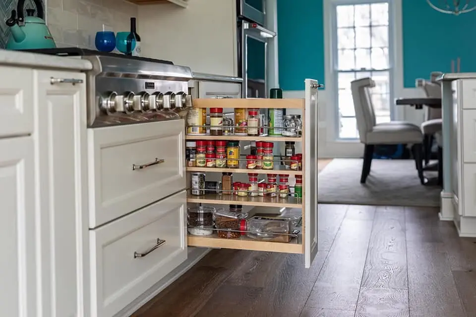 a kitchen with a cabinet door