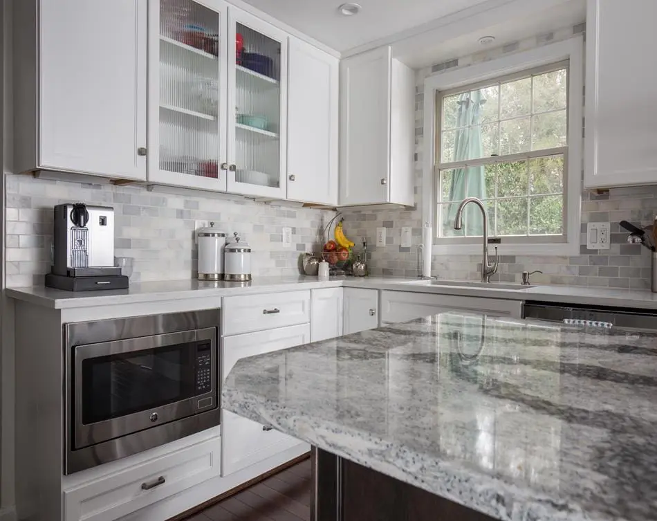 a kitchen with a marble countertop