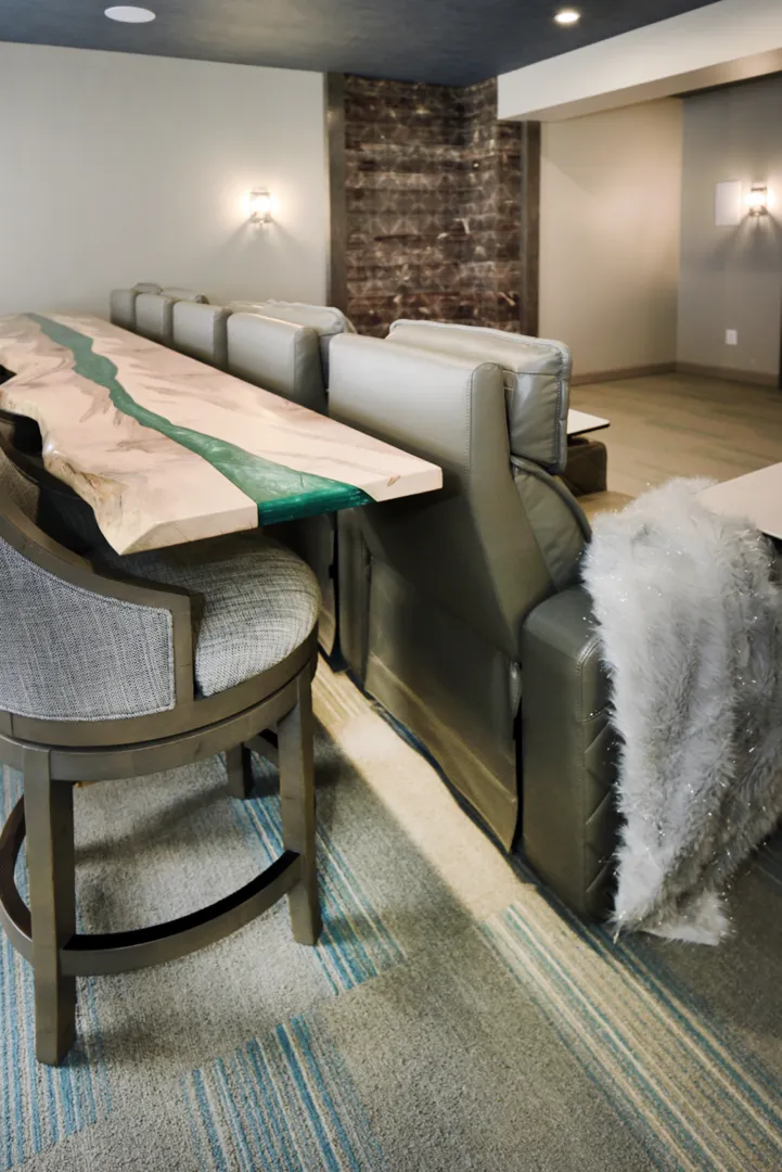 a table with a wood top and chairs in a room