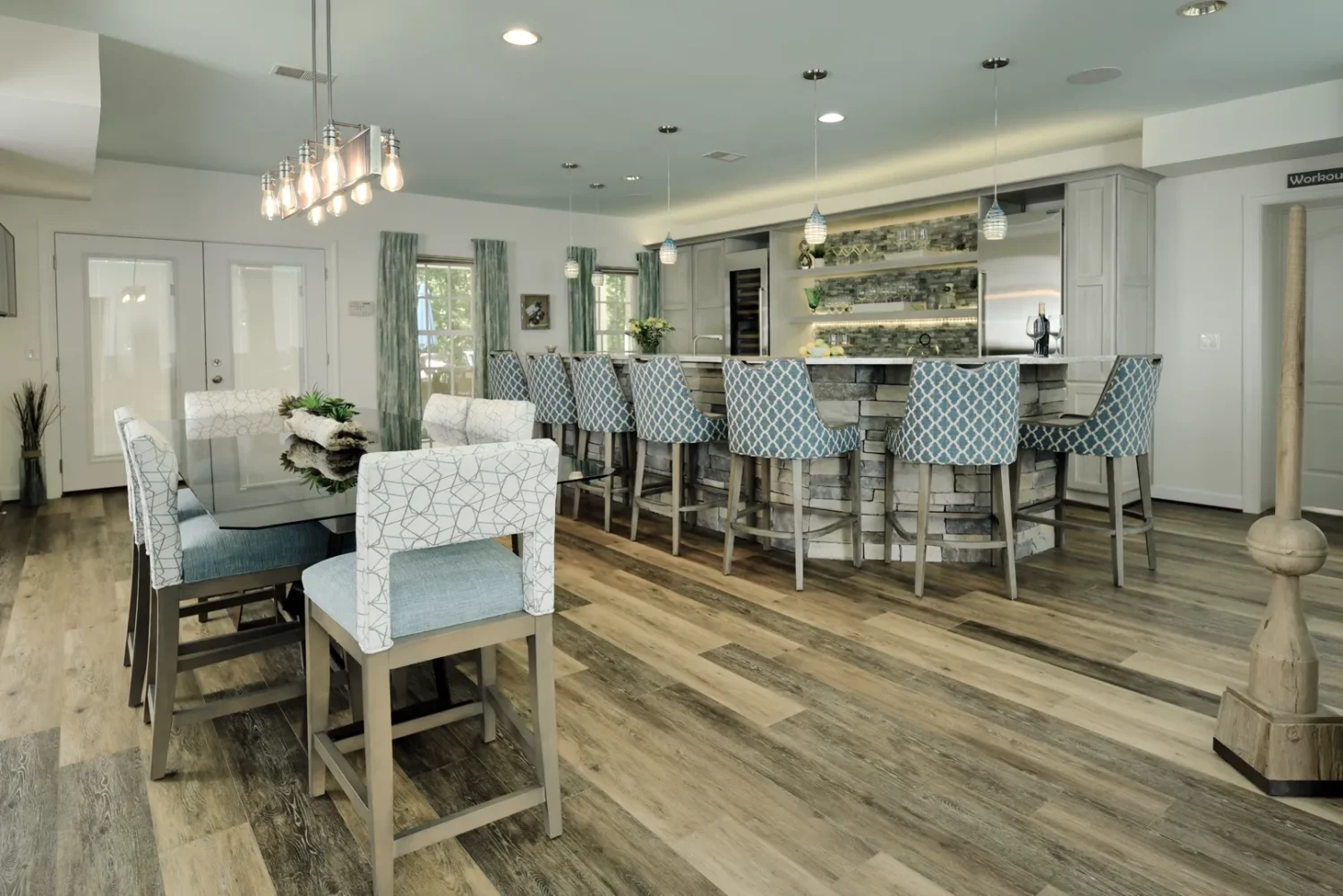 a room with a bar and chairs