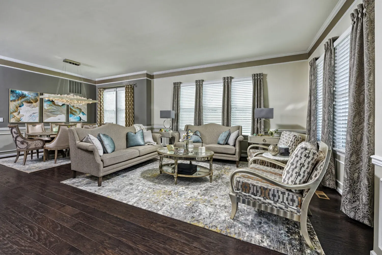a living room with a couch and chairs