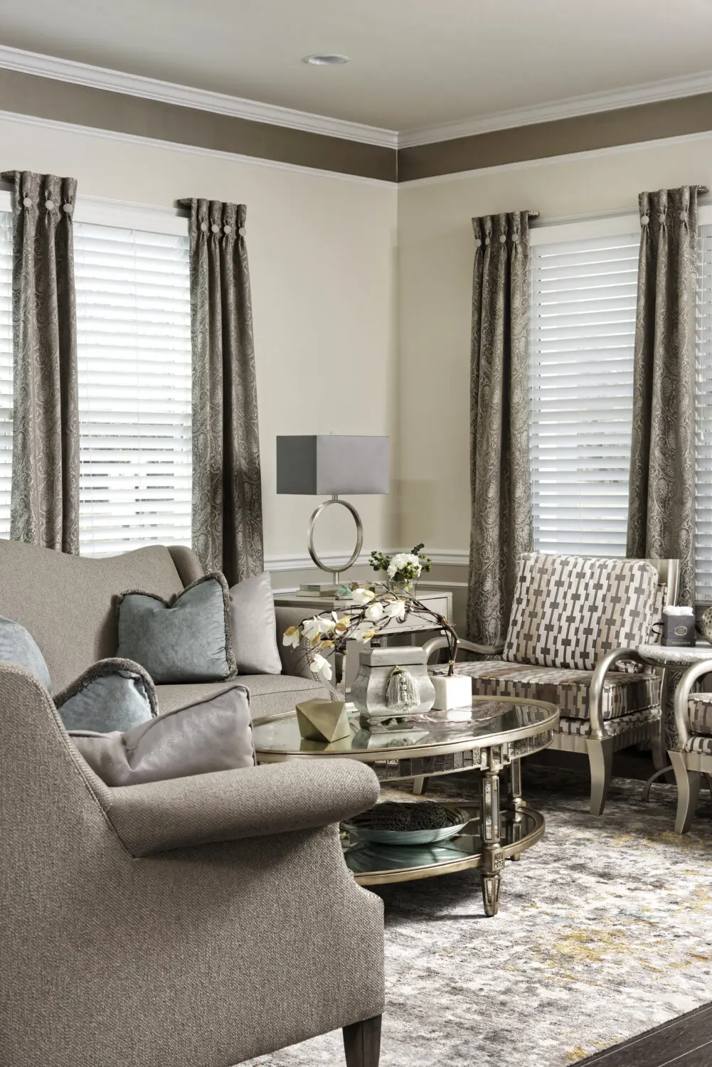 a living room with a couch and chairs