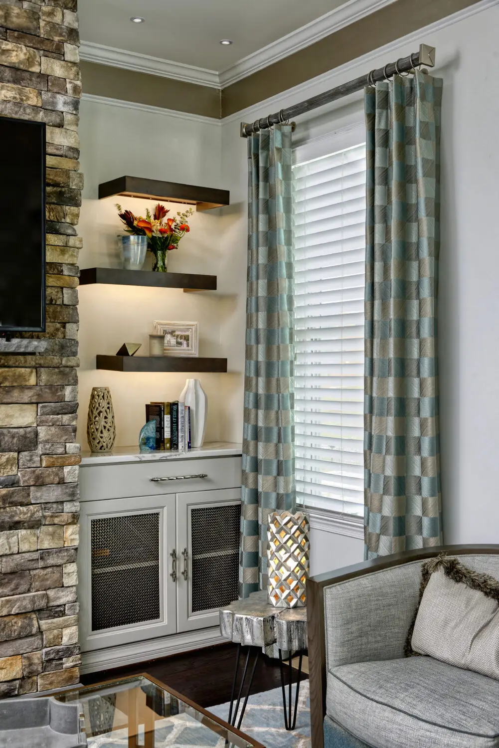 a room with a stone wall and a window