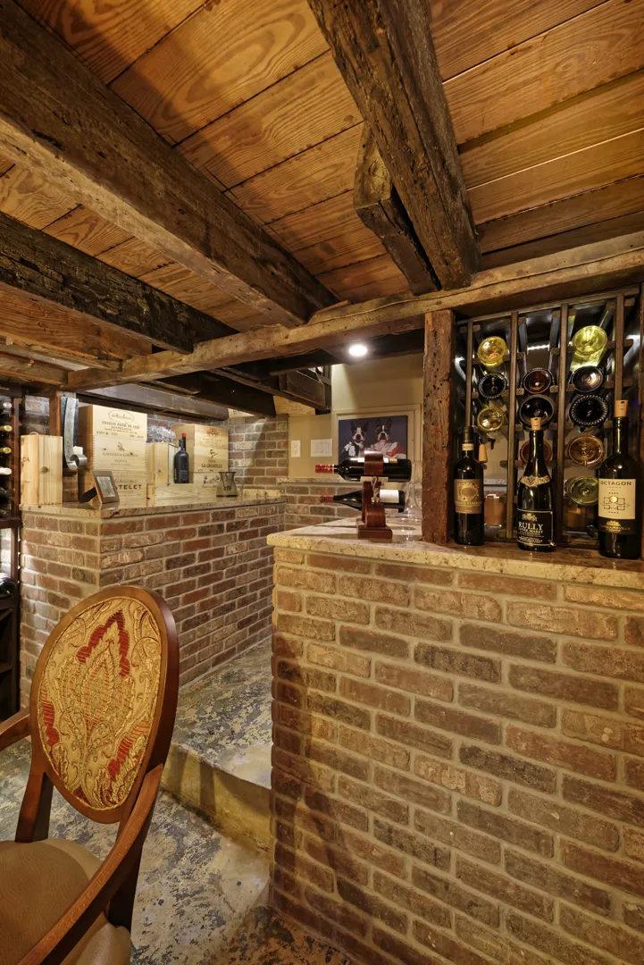a room with brick walls and a brick wall and a chair