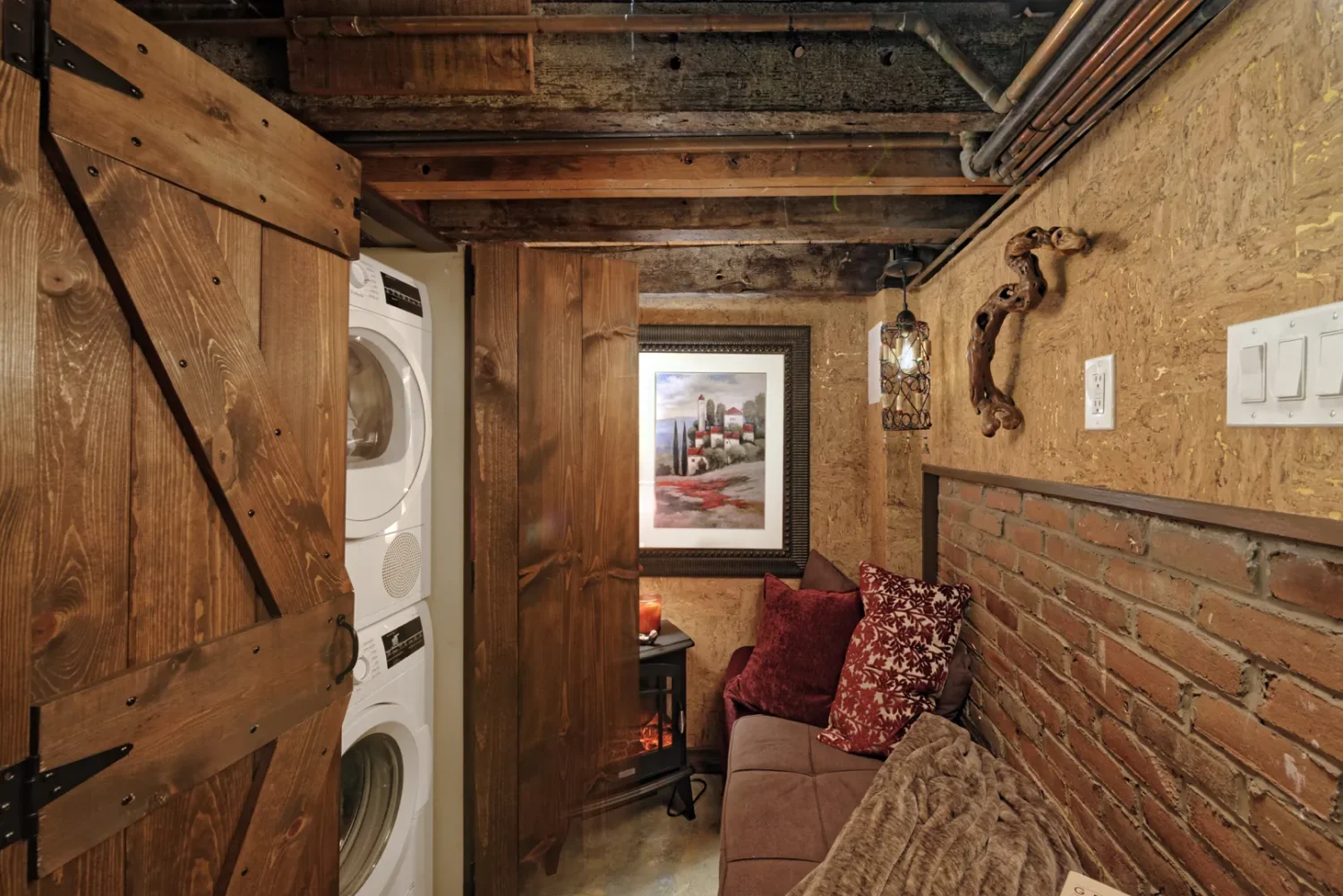 a room with a couch and dryer