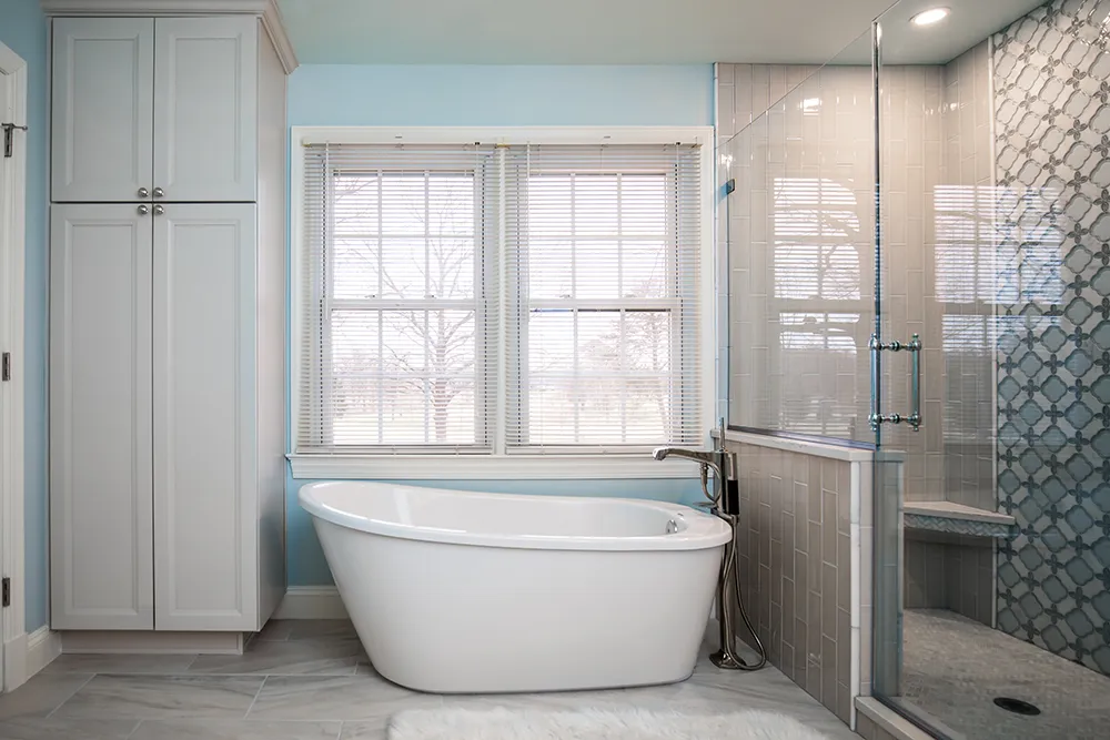 a bathroom with a tub and shower