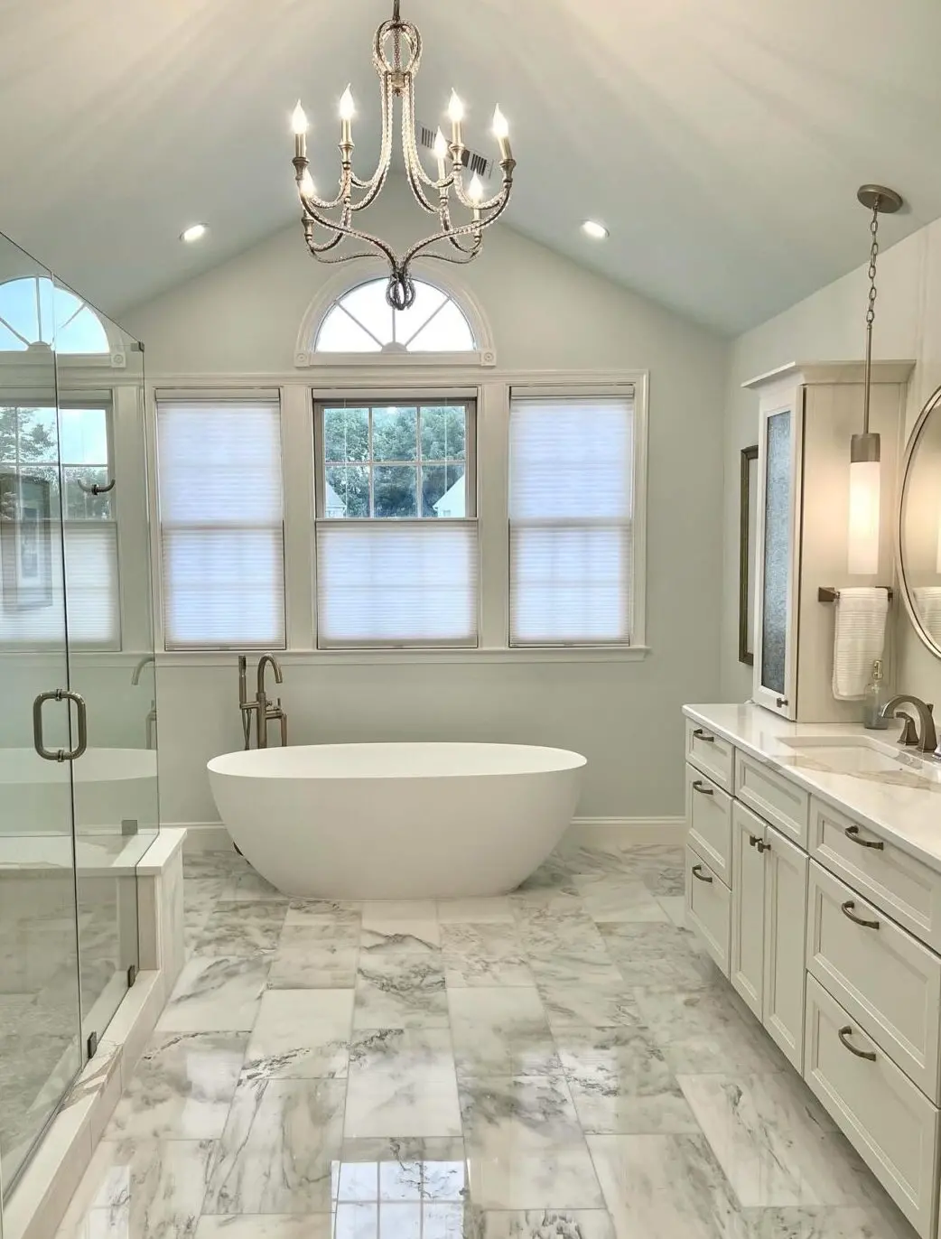 a bathroom with a tub and a shower