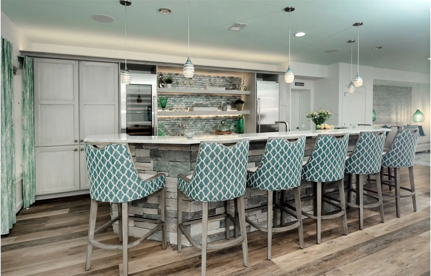 a kitchen with a bar and stools