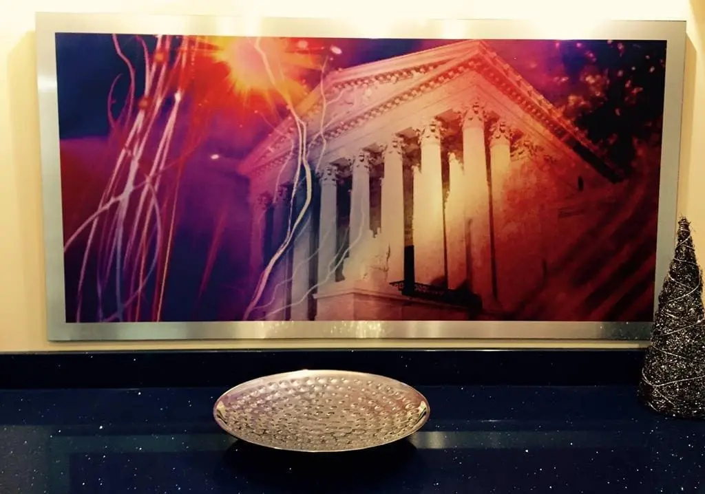 a silver bowl on a black counter
