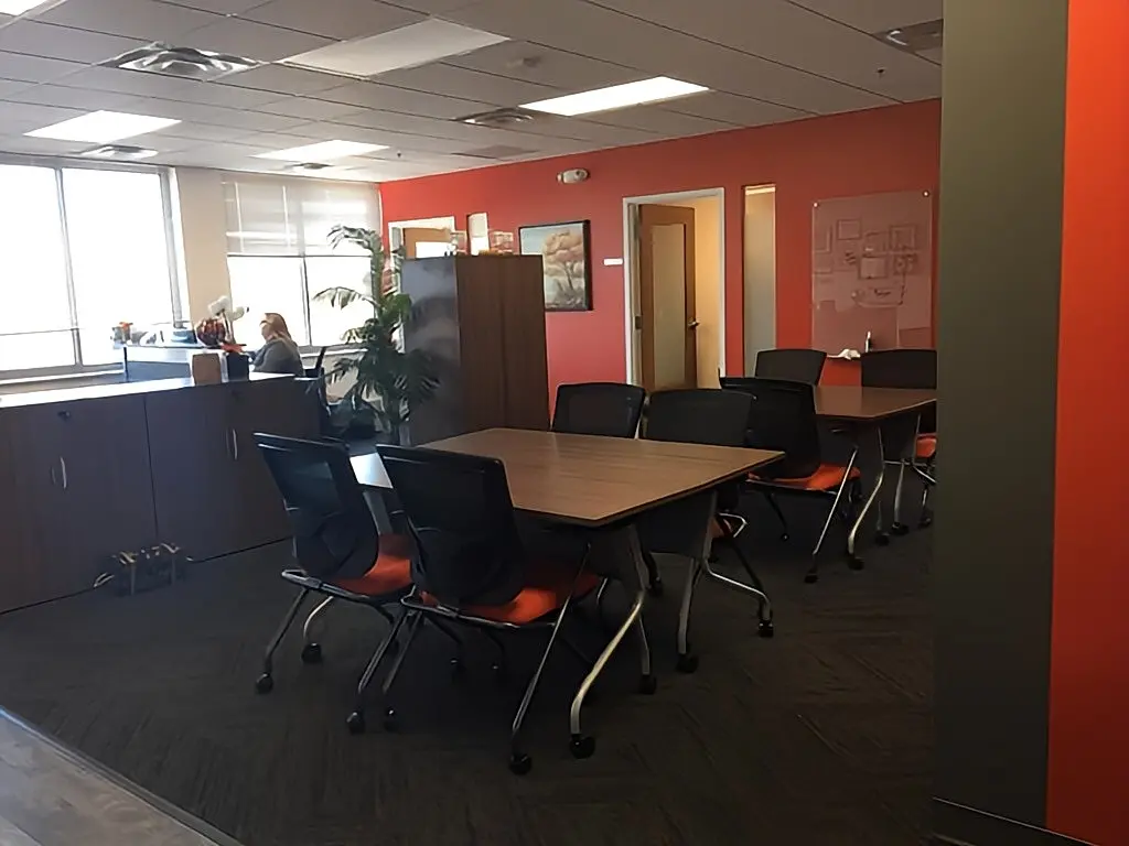 a room with a table and chairs