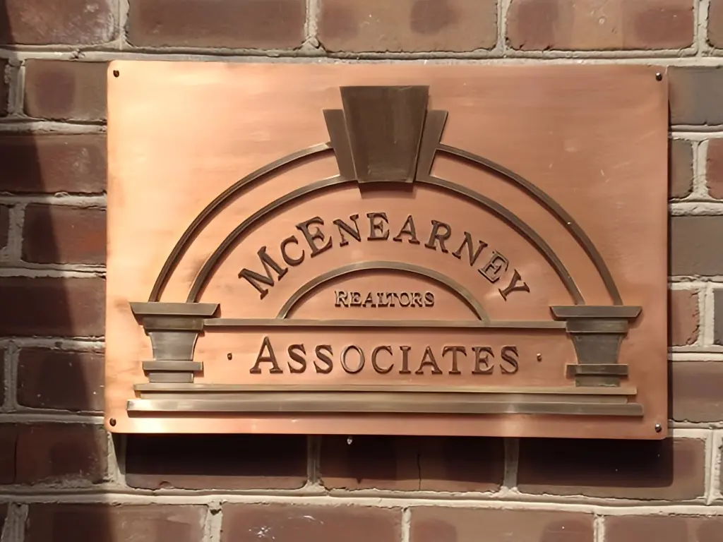 a sign on a brick wall