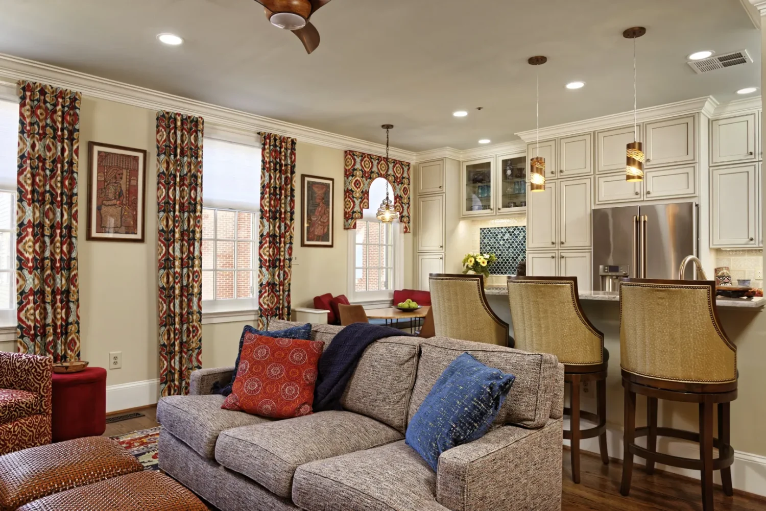 a living room with a couch and kitchen